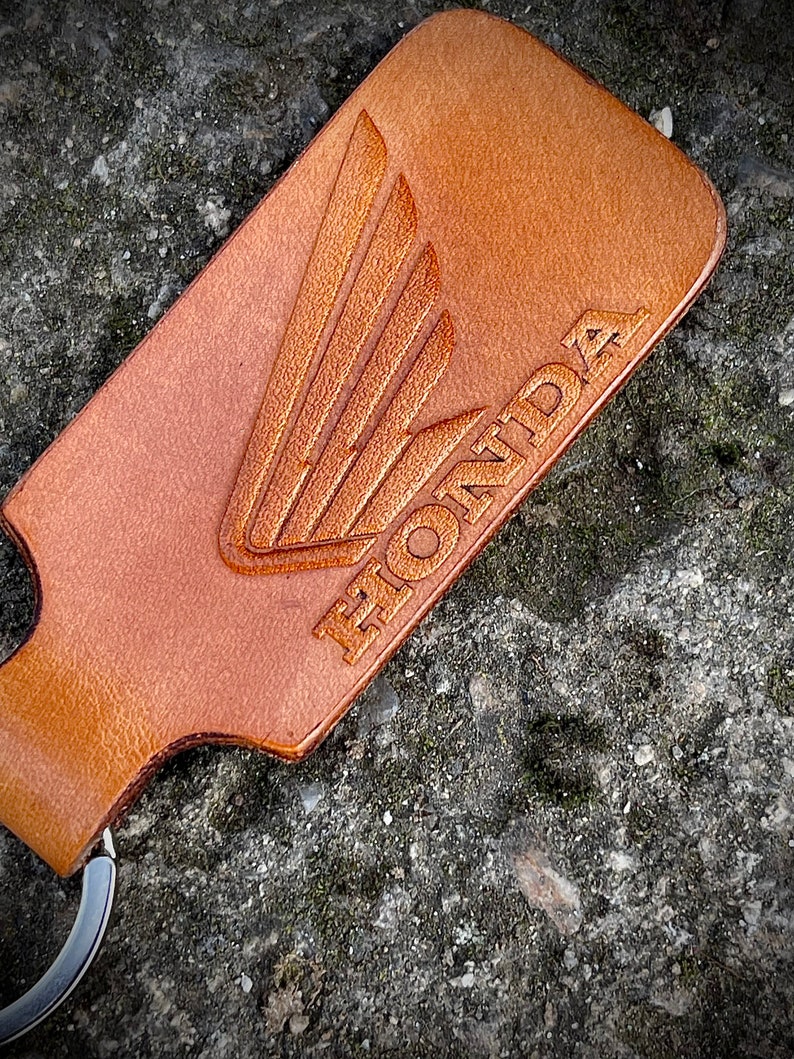 Handmade leather keychain with Honda Wing logo in Brown. 1EA