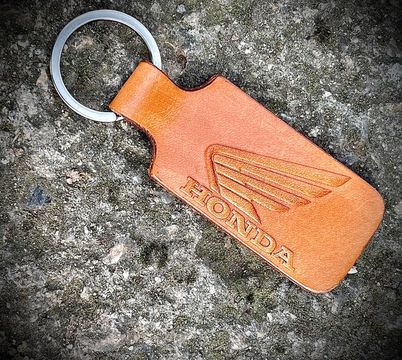 Handmade leather keychain with Honda Wing logo in Brown. 1EA